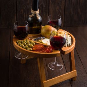 Винный столик  Гармоника  (Бук)— это стильный подарок, оригинальный и изысканный вариант сервировки стола и подачи закусок (сыра, фруктов, орехов). 
Представлен в 2-х размерах : 35 см и 29 см.