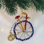 Новогоднее украшение из стеклянных бусин «Пенни-фартин» синий