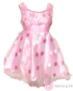 Праздничное платье розового цвета с цветами в горошек.
